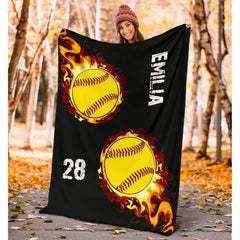 Vibrant sports motif displaying blazing crimson flames and optic yellow softballs on deep black.
