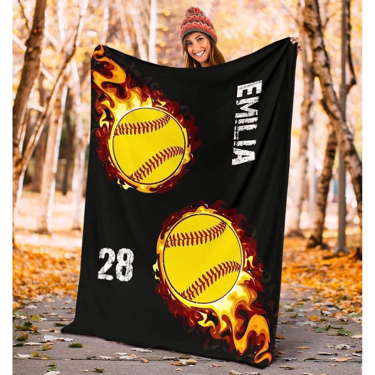 Vibrant sports motif displaying blazing crimson flames and optic yellow softballs on deep black.
