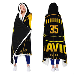 Close up of black and gold football throw blanket highlighting luminous gold athletic typography