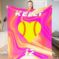 Folded athletic blanket highlighting bright yellow heart and pink swirls
