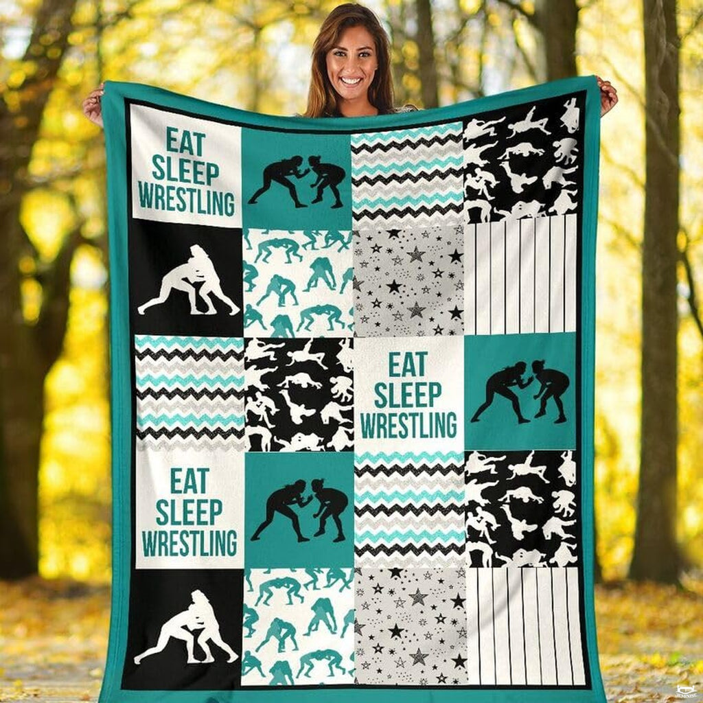 Teal wrestling sports throw blanket styled across a bed in a modern bedroom setting.