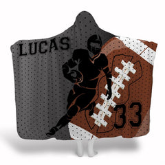 Football player running back silhouette with angled football emblem and jersey mesh, view 1.