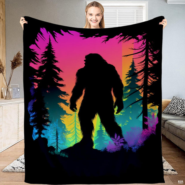 Bigfoot neon sunset forest blanket featuring Sasquatch silhouette in pine woods.