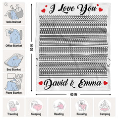 Couple in bedroom relaxing under optical illusion throw blanket displaying black and white line art
