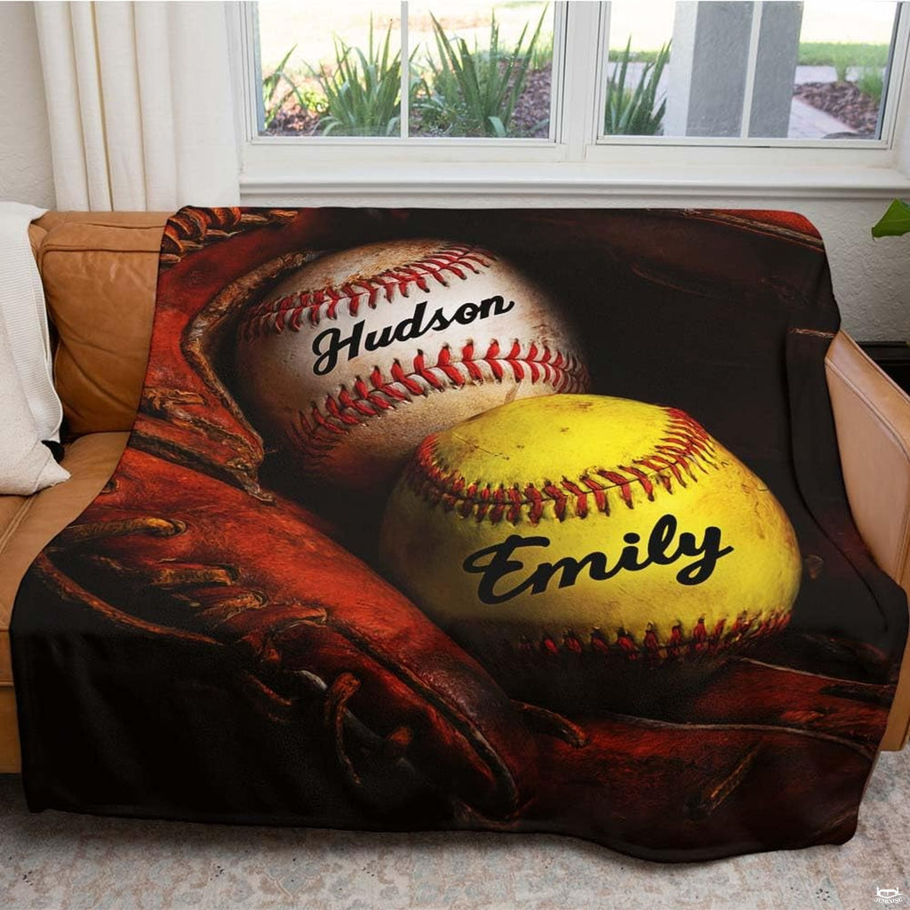 Close view of baseball and optic softball inside ball glove on blanket