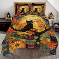 Harvest moon black cat bedding featuring feline perched on tree bough beside pumpkin under glowing amber moon