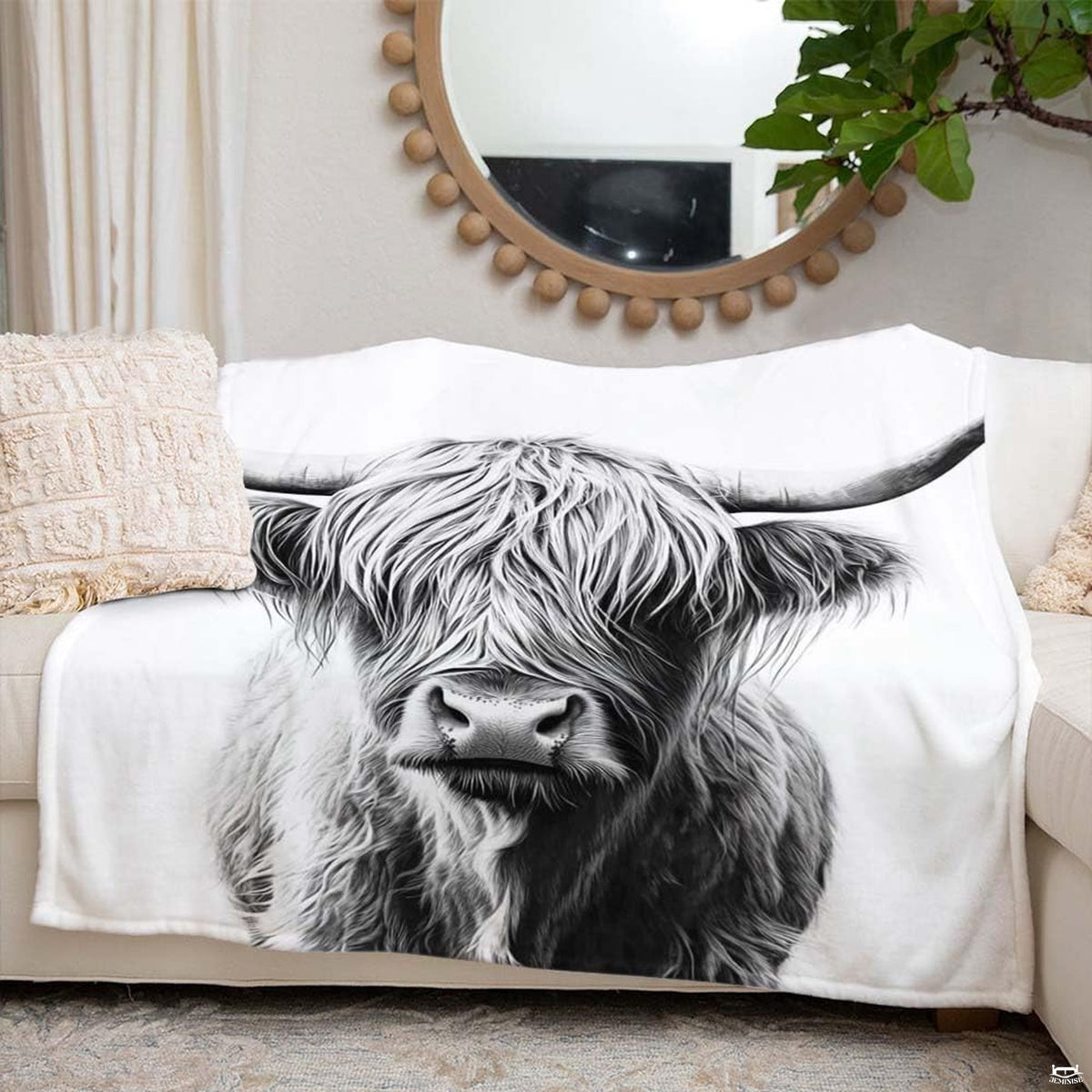 Side angle view of monochrome rustic highland cow decor bedding set on bed frame