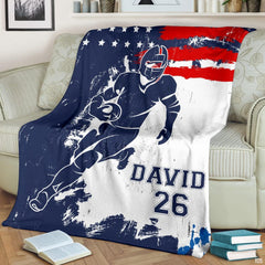 Patriotic gridiron breakaway runner football blanket draped over sofa