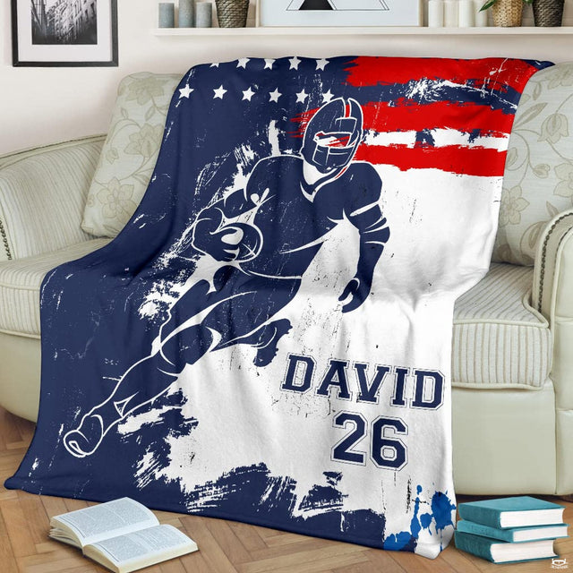 Patriotic gridiron breakaway runner football blanket draped over sofa