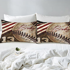 Side angle view of athletic sports bedding showing rustic rust red and sand khaki tones draped on mattress