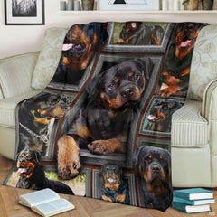 Rottweiler throw blanket styled across a living room sofa near stacked books and a cup.