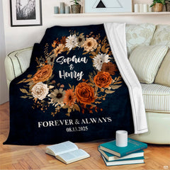 Living room decor setting featuring autumn floral wreath throw blanket draped over sectional couch