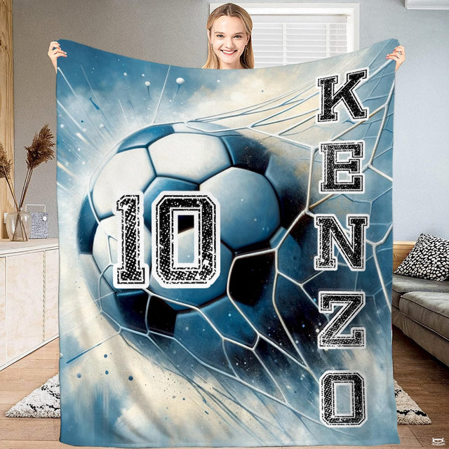 Soccer bedding set displaying dynamic goal net strike illustration with blue impact splatters.