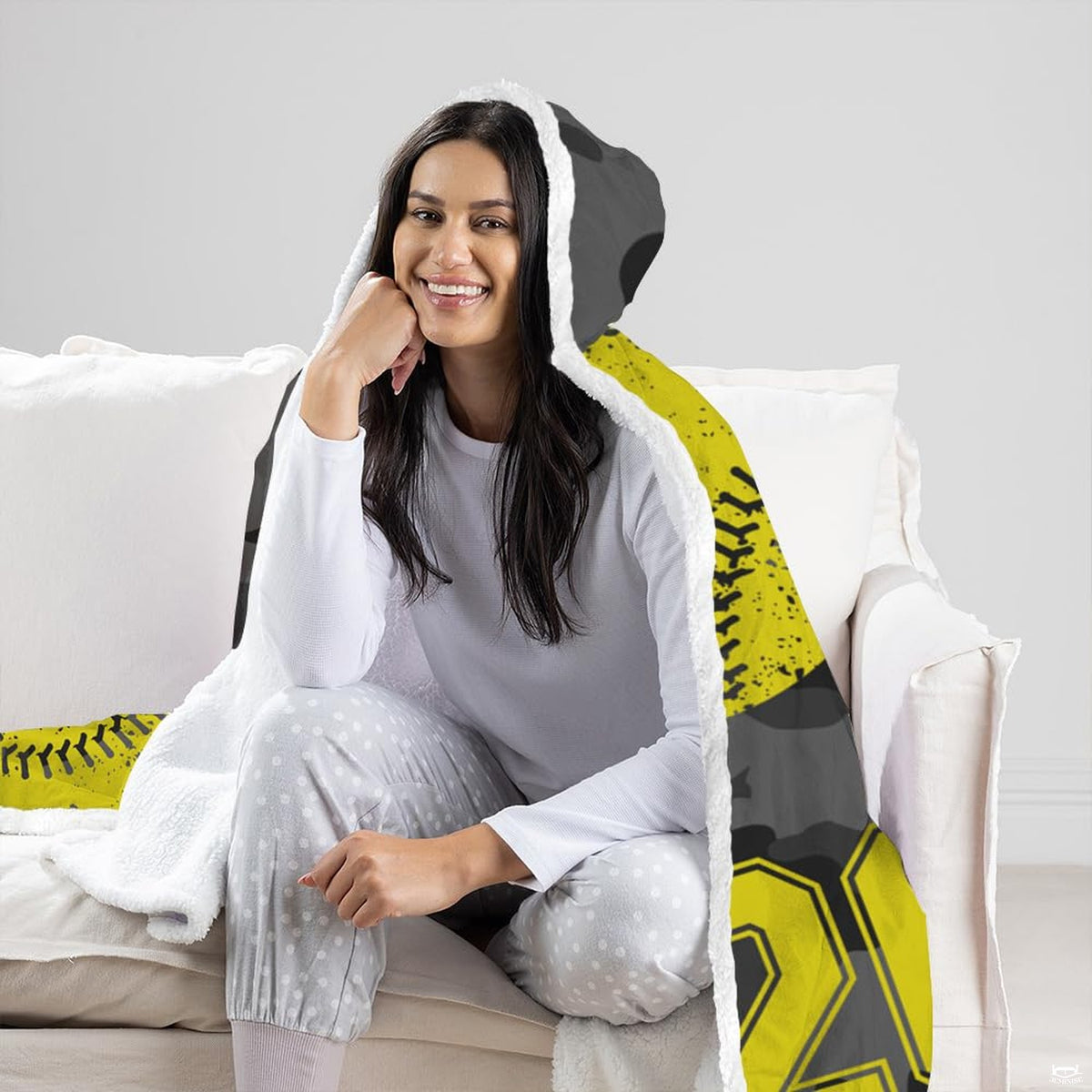 Folded display of softball sports blanket showing corner finish and vibrant print quality.