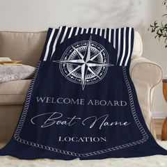 Close-up view of the detailed eight-pointed compass rose dial design on navy coastal bedding.