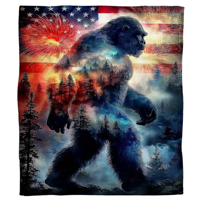 Patriotic Bigfoot throw blanket view 2 highlighting Sasquatch silhouette, pine forest, and night fireworks
