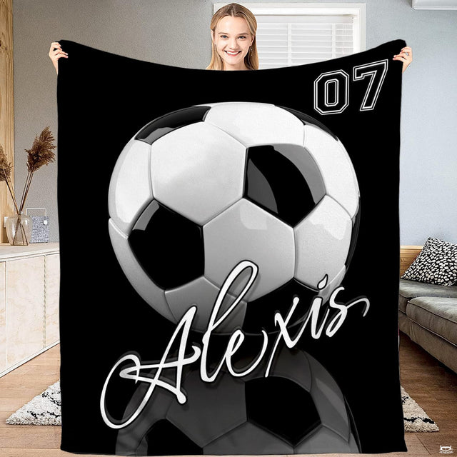 Dimensional soccer ball bedding display with athletic block numbering and flowing script.