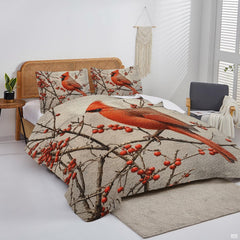 Overhead view of little bird bedding set displaying cardinal motifs and textured parchment tones.