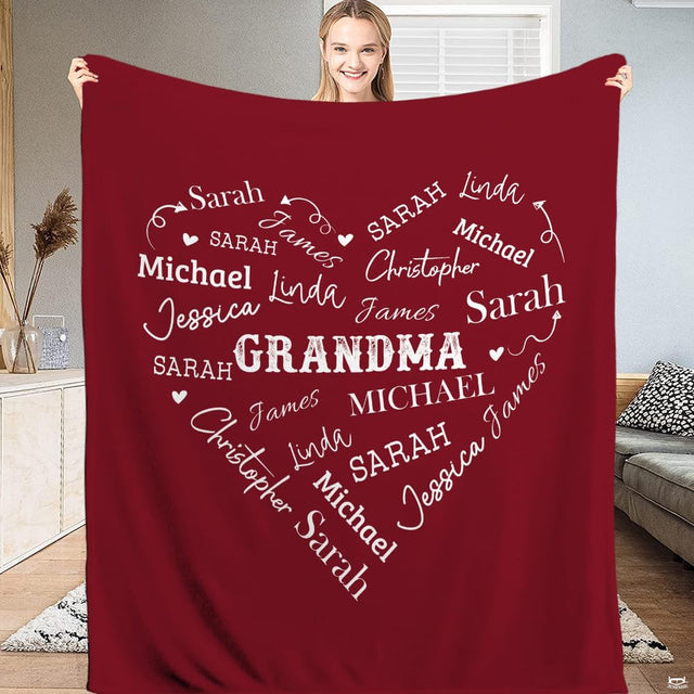 Crimson bedding set featuring artistic white script lettering and heart graphics displayed on a bed.