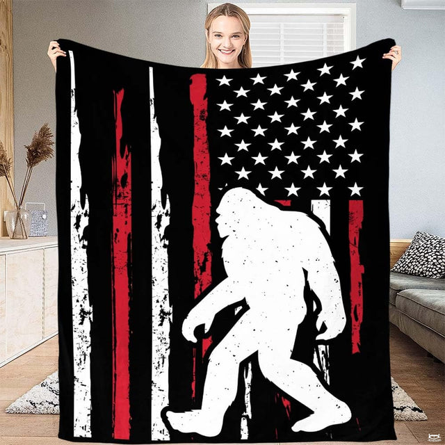Patriotic Bigfoot American flag throw blanket featuring white Sasquatch silhouette on distressed USA flag