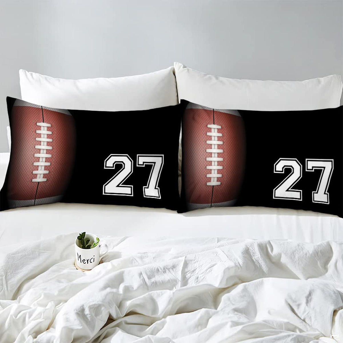 Corner fold view of football bedding highlighting sharp graphic printing on dark background
