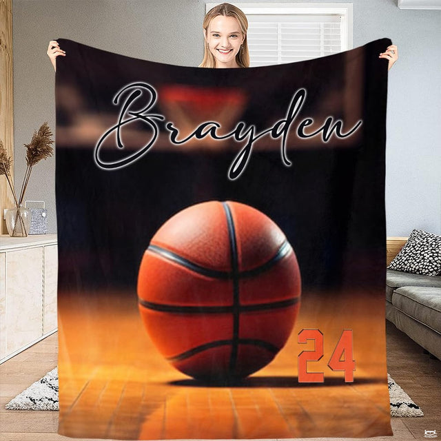 Woman holding open basketball on hardwood court sports throw blanket in bright room