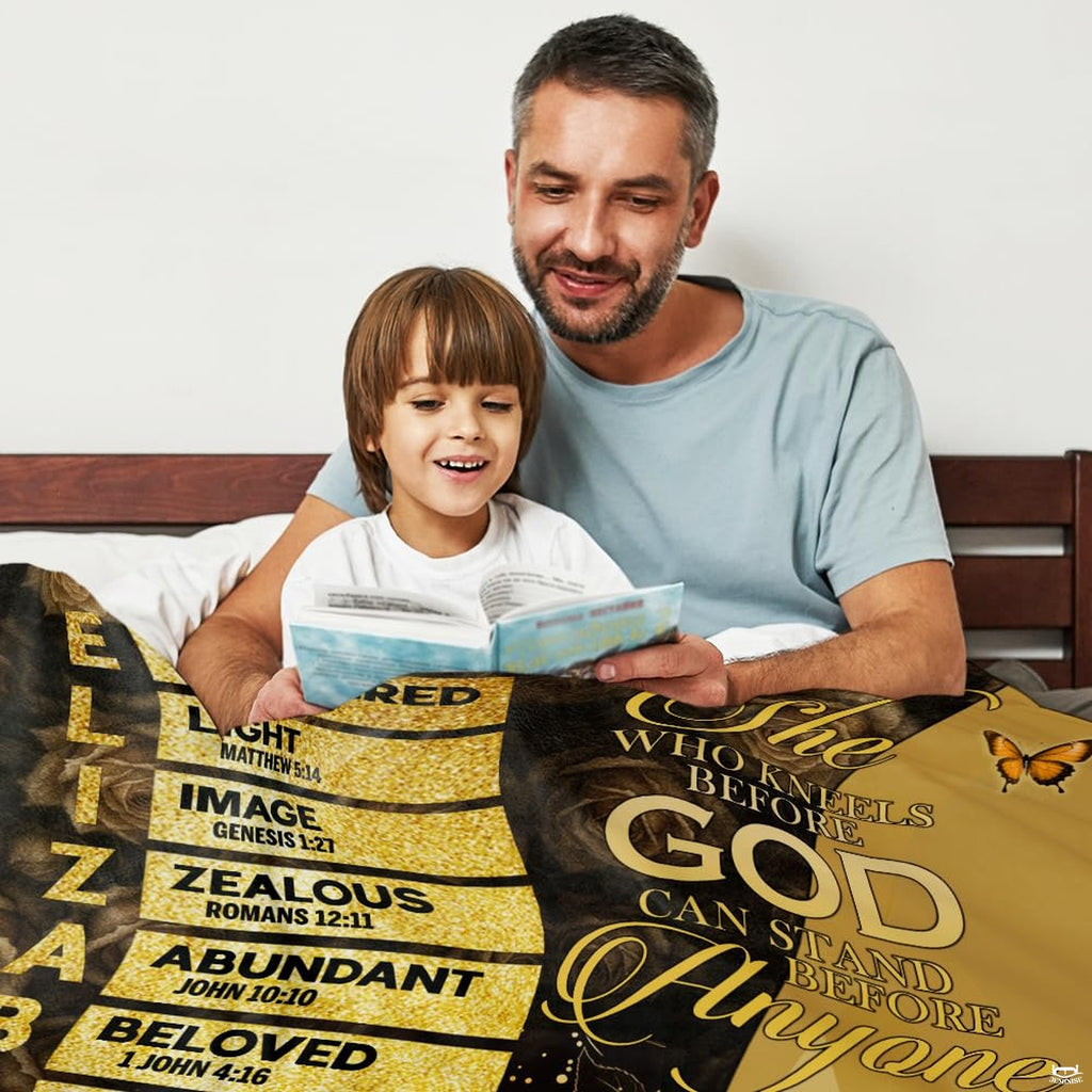 Faith themed art throw blanket draped across a living room couch.