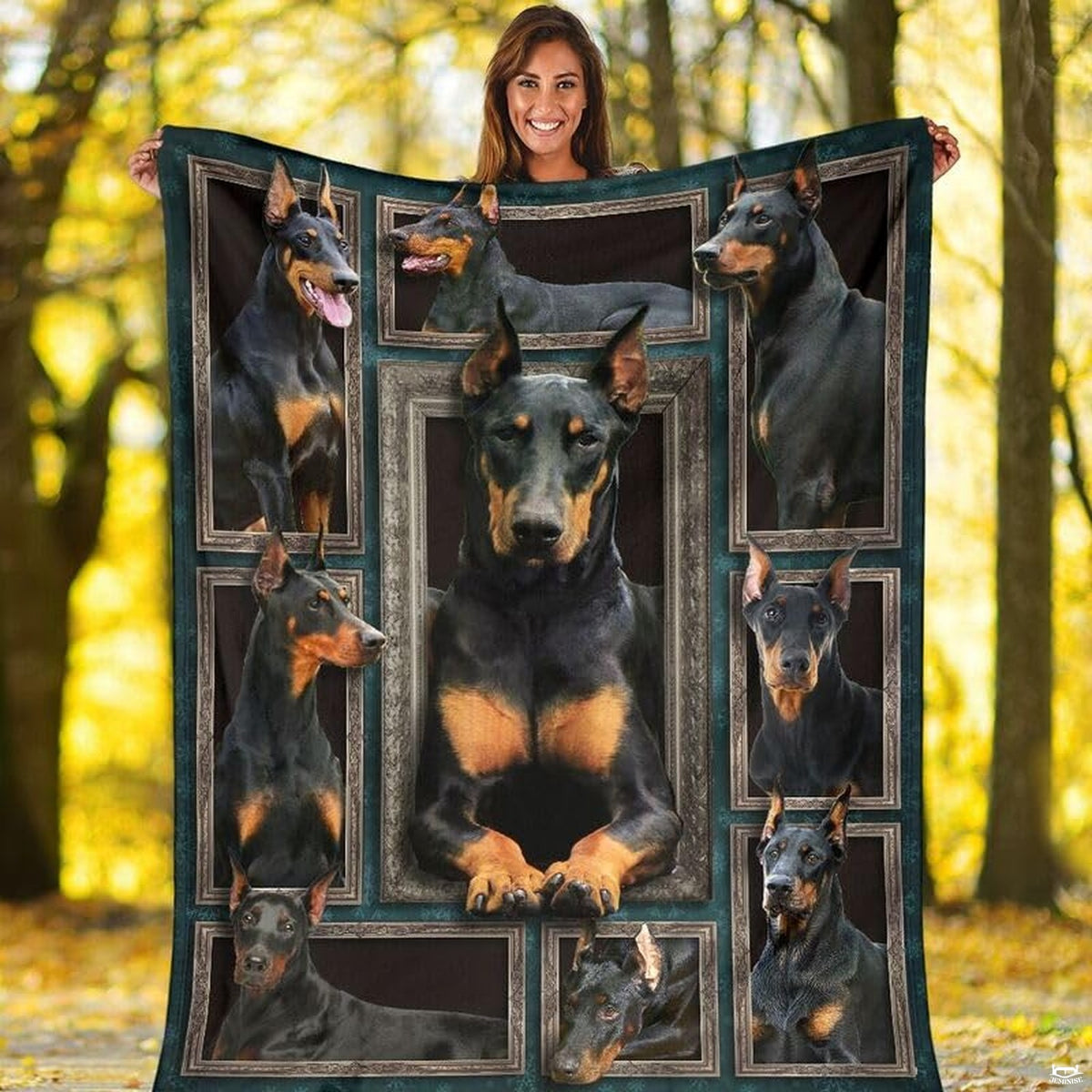 Outdoor view of a model holding up the full Doberman Pinscher gallery throw blanket.