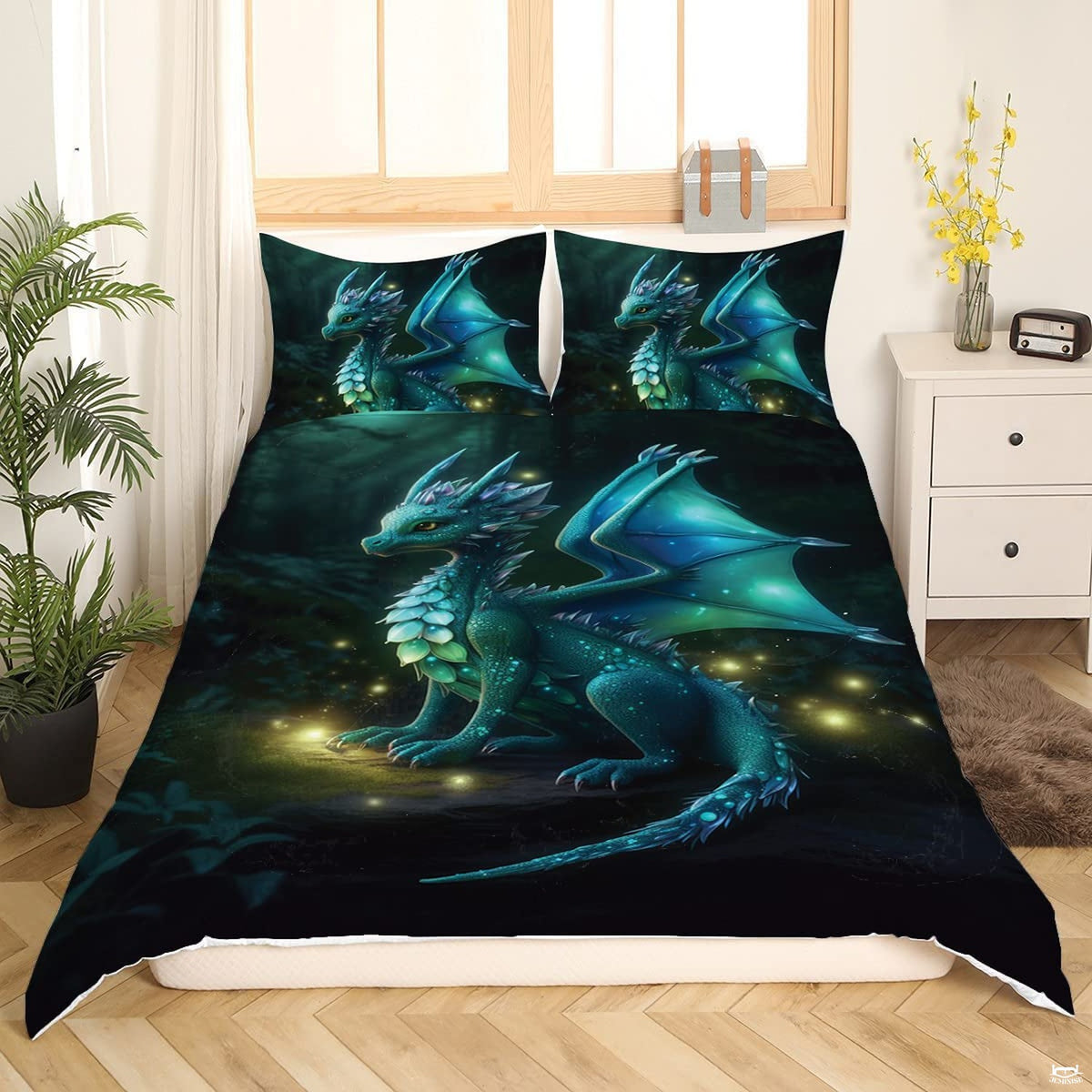 Enchanted forest dragon bedding featuring a teal baby dragon with glowing wings amidst illuminated fireflies