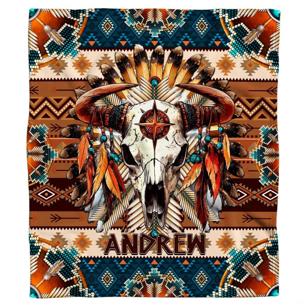 Close-up view of bull skull horns, hanging feathers, turquoise beads, and star emblem.