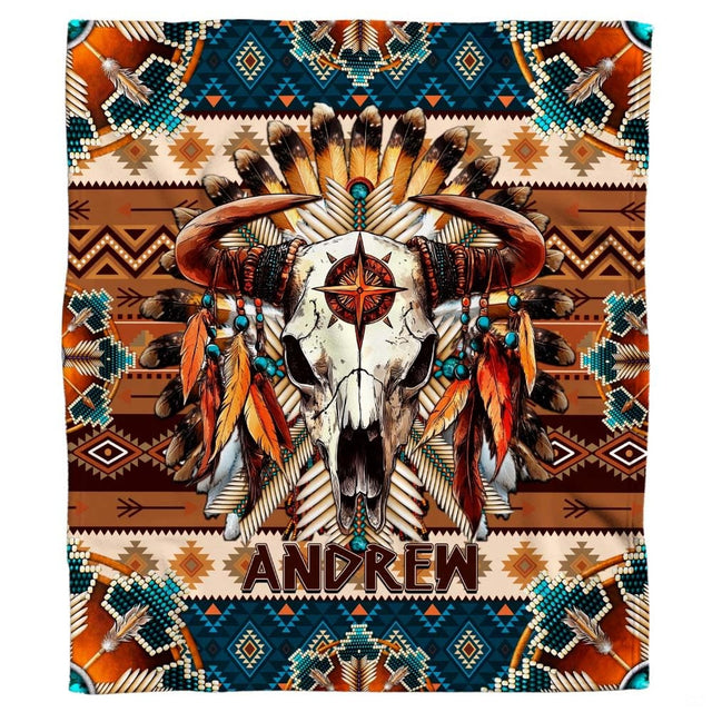 Close-up view of bull skull horns, hanging feathers, turquoise beads, and star emblem.