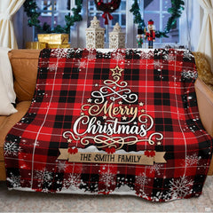 Rustic buffalo plaid Christmas graphic blanket styled across bed
