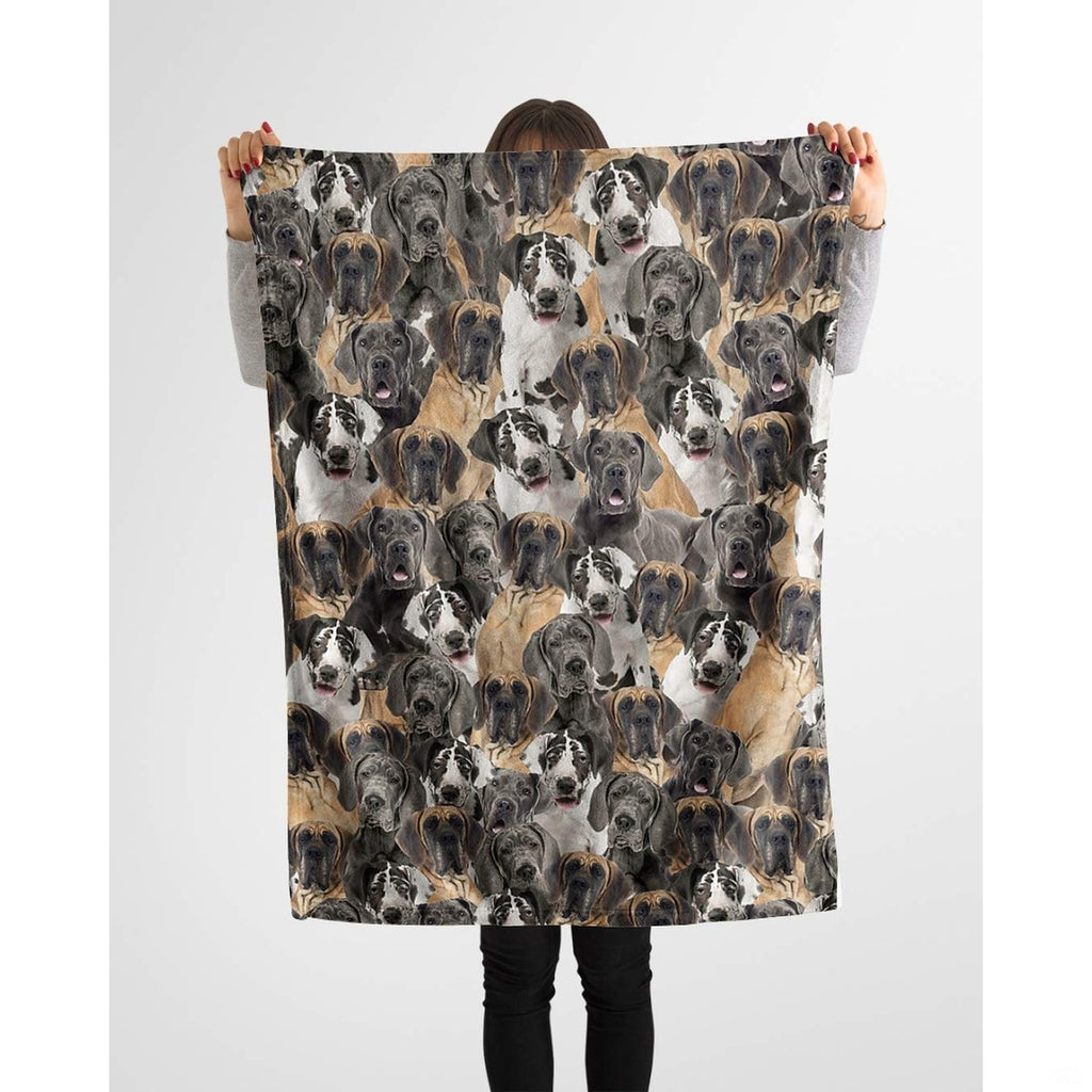 Person holding up a repeating Great Dane canine blanket against a plain background.
