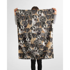 Person holding up a repeating Great Dane canine blanket against a plain background.
