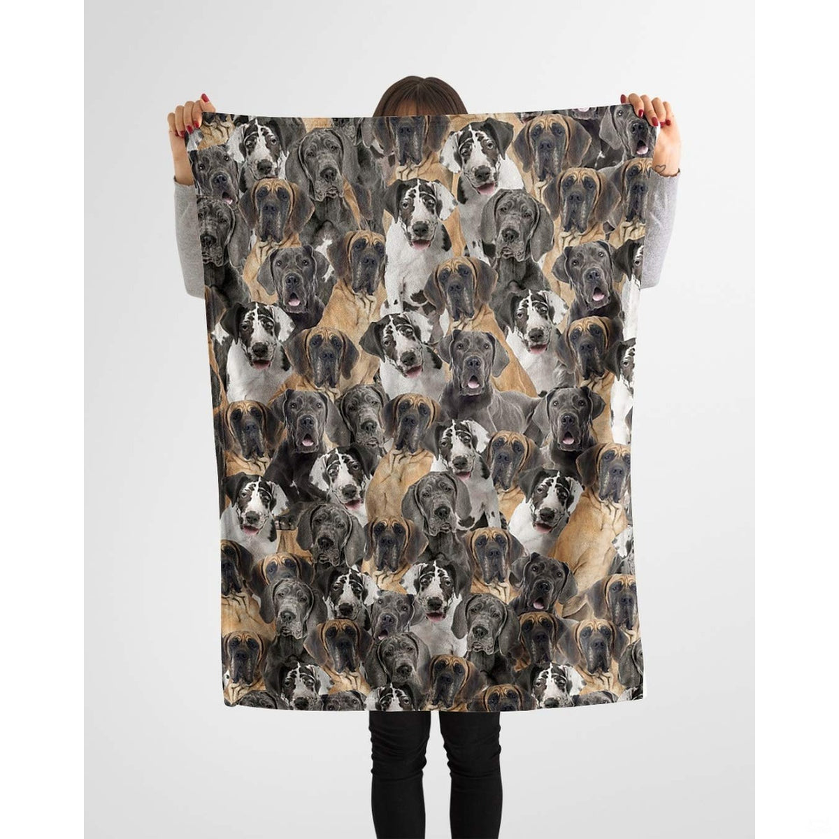 Person holding up a repeating Great Dane canine blanket against a plain background.