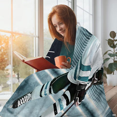 Youth hockey skater graphic blanket draped across living room couch