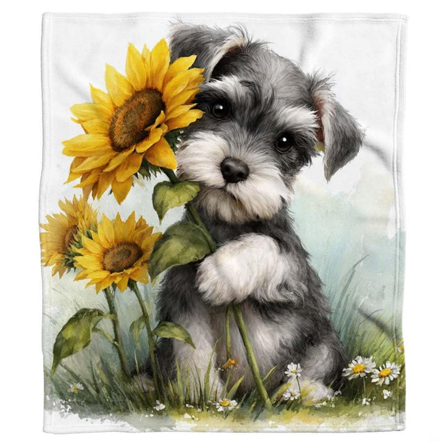 Close-up of the Miniature Schnauzer face with bushy eyebrows, sweet dark eyes, and golden sunflower petals