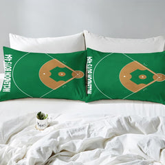 Side angle view of athletic sports bedding showing vibrant green and gold tones draped on mattress