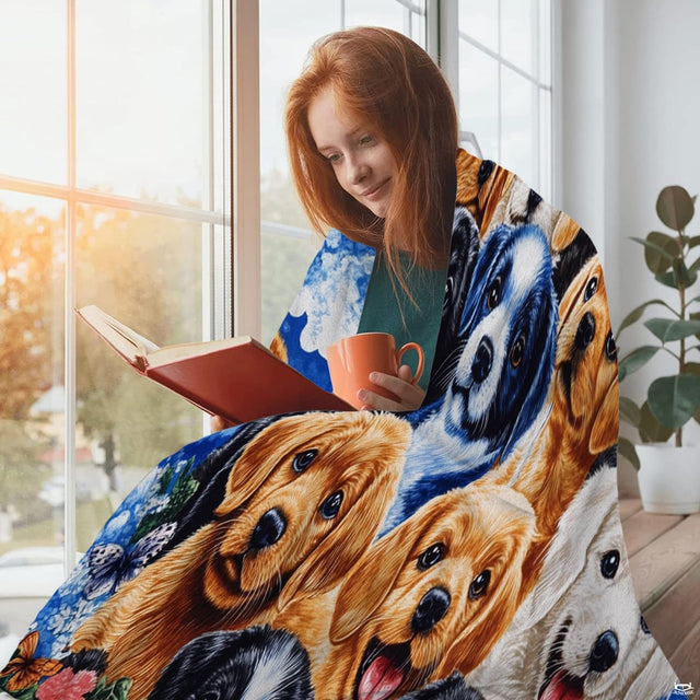 Puppy collage royal blue throw blanket held open showing vibrant canine group portrait