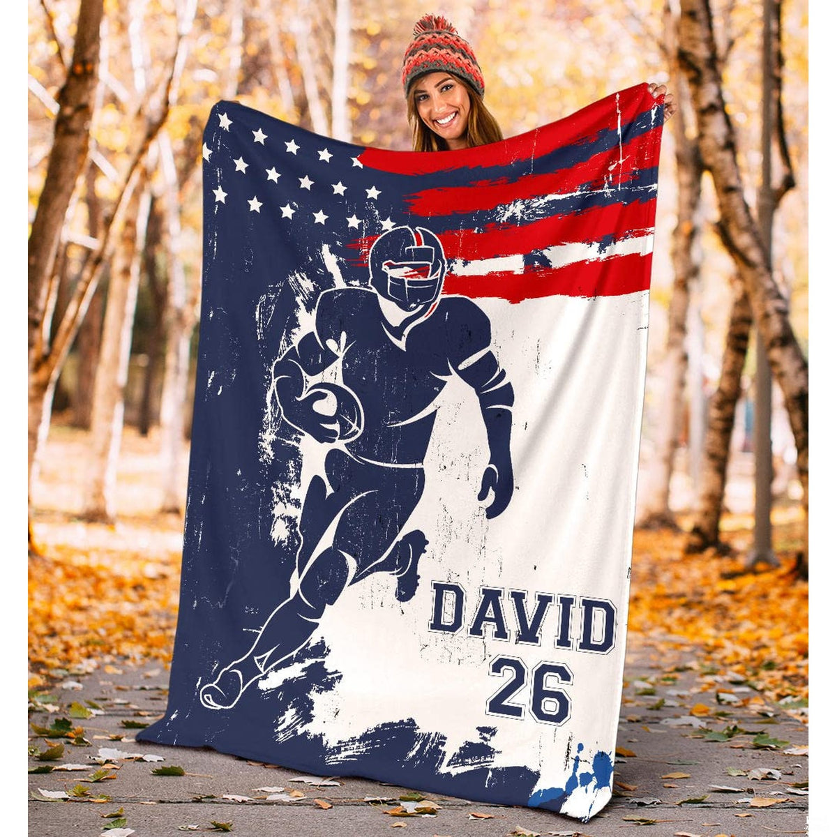 Folded athletic blanket highlighting distressed red banner and navy silhouette
