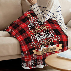 Buffalo plaid Christmas graphic blanket spread flat on floor area