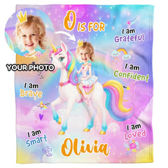 Pastel unicorn fantasy blanket styled across contemporary bed