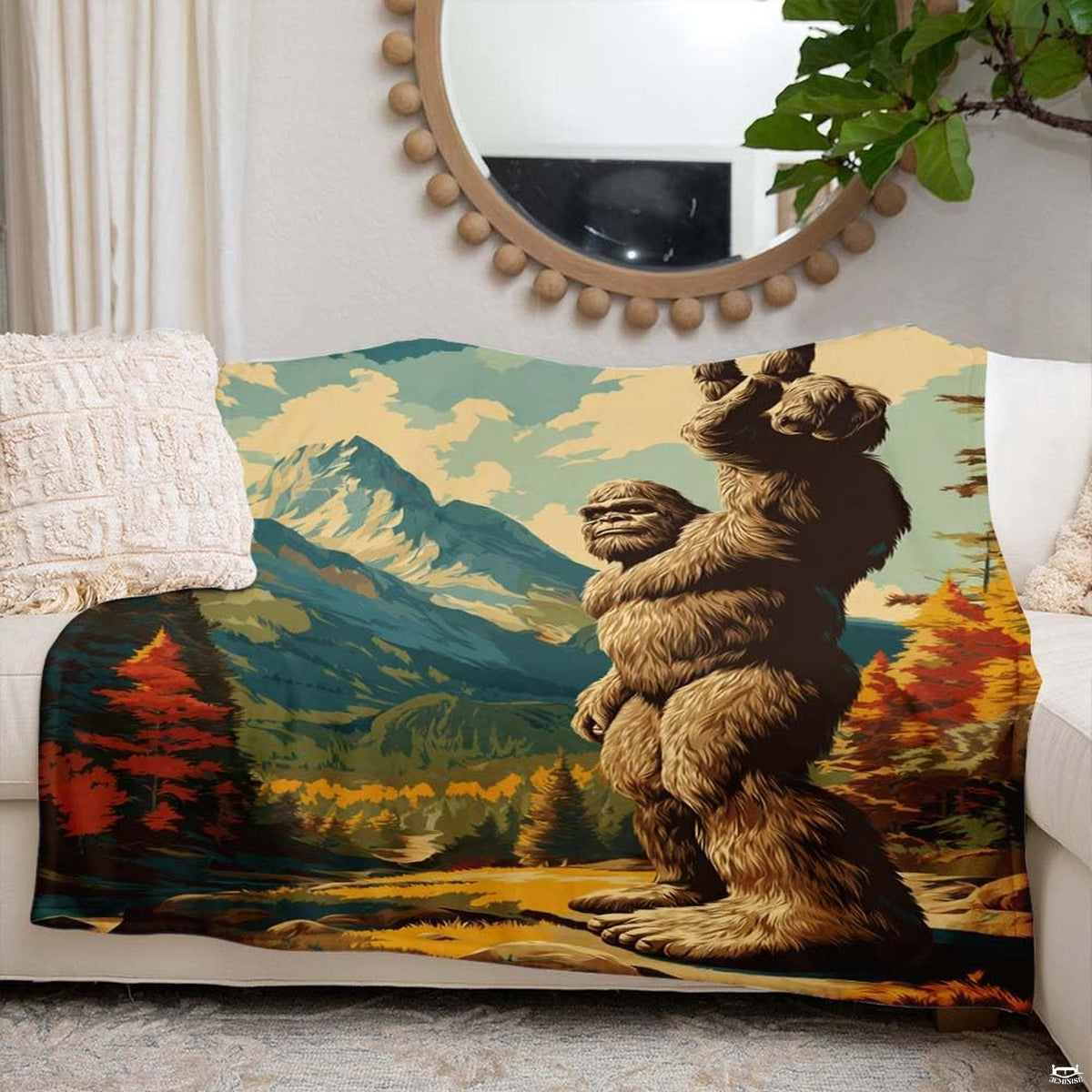 Peace sign bigfoot forest blanket styled across contemporary neutral couch
