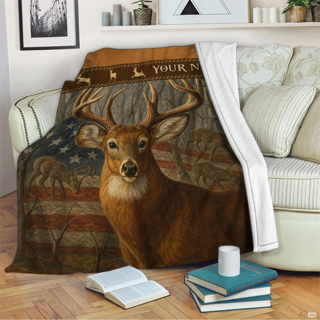 Patriotic whitetail flag blanket draped across an indoor living room couch next to stacked books.