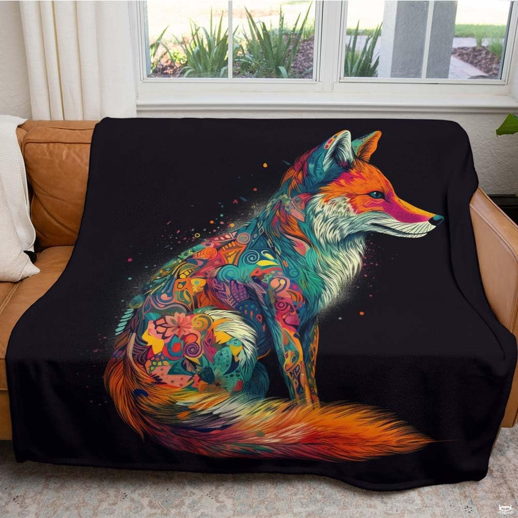 Close-up perspective of vibrant swirl and floral details on colorful fox throw blanket