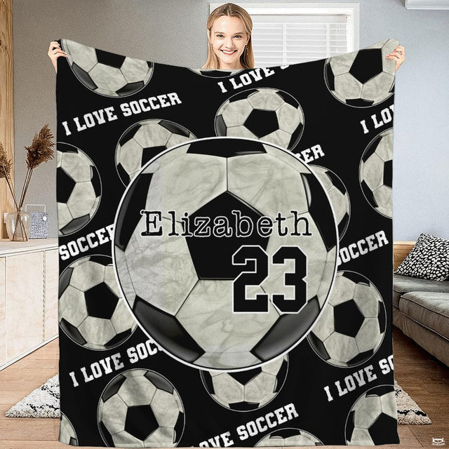Soccer ball pattern and medallion graphic blanket front display