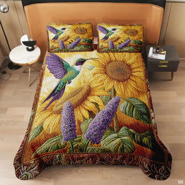 Overhead view of hummingbird sunflower bedding with purple floral accents