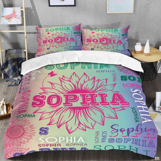 Close-up view of unicorn bedding highlighting ornate mythical creature silhouette and raspberry floral wreath