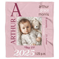 Pastel blush baby bedding sets display featuring milestone typography artwork in burgundy and mauve tones.