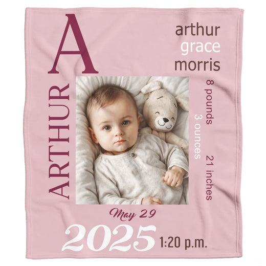 Pastel blush baby bedding sets display featuring milestone typography artwork in burgundy and mauve tones.